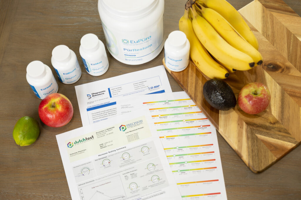 Flat lay shot of coaching supplements and documents during branding session in Utah.