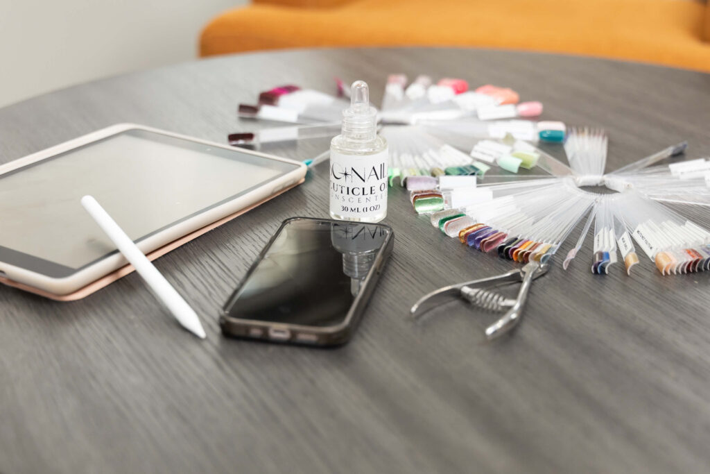 Flat lay of nail artist's tools during a brand shoot in Utah with Sara Vaz.