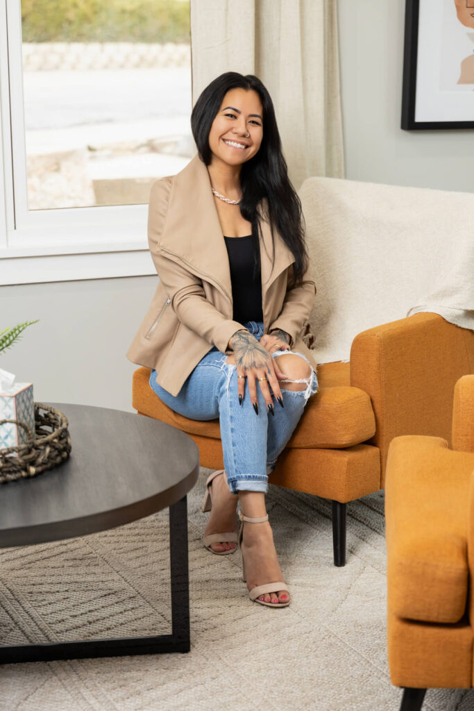 Cute pose of a woman in a chair during her branding shoot in Utah.